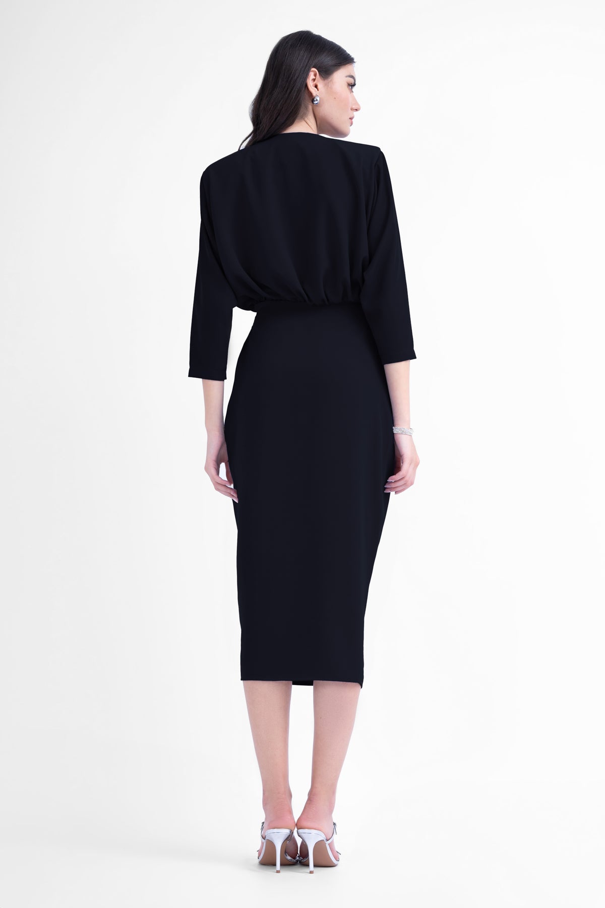 Black midi dress with draping detailing and waist belt