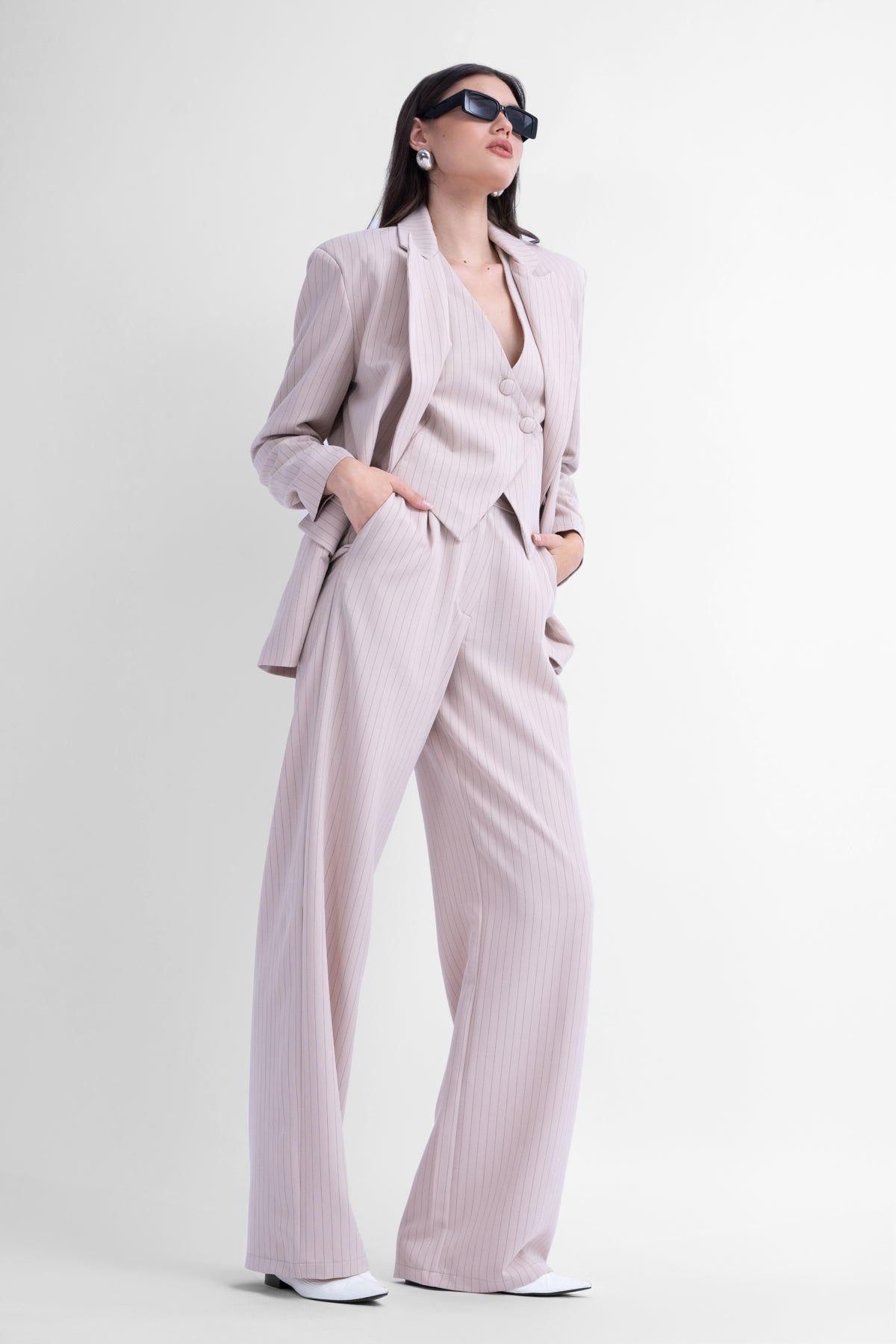 Three-piece beige striped suit
