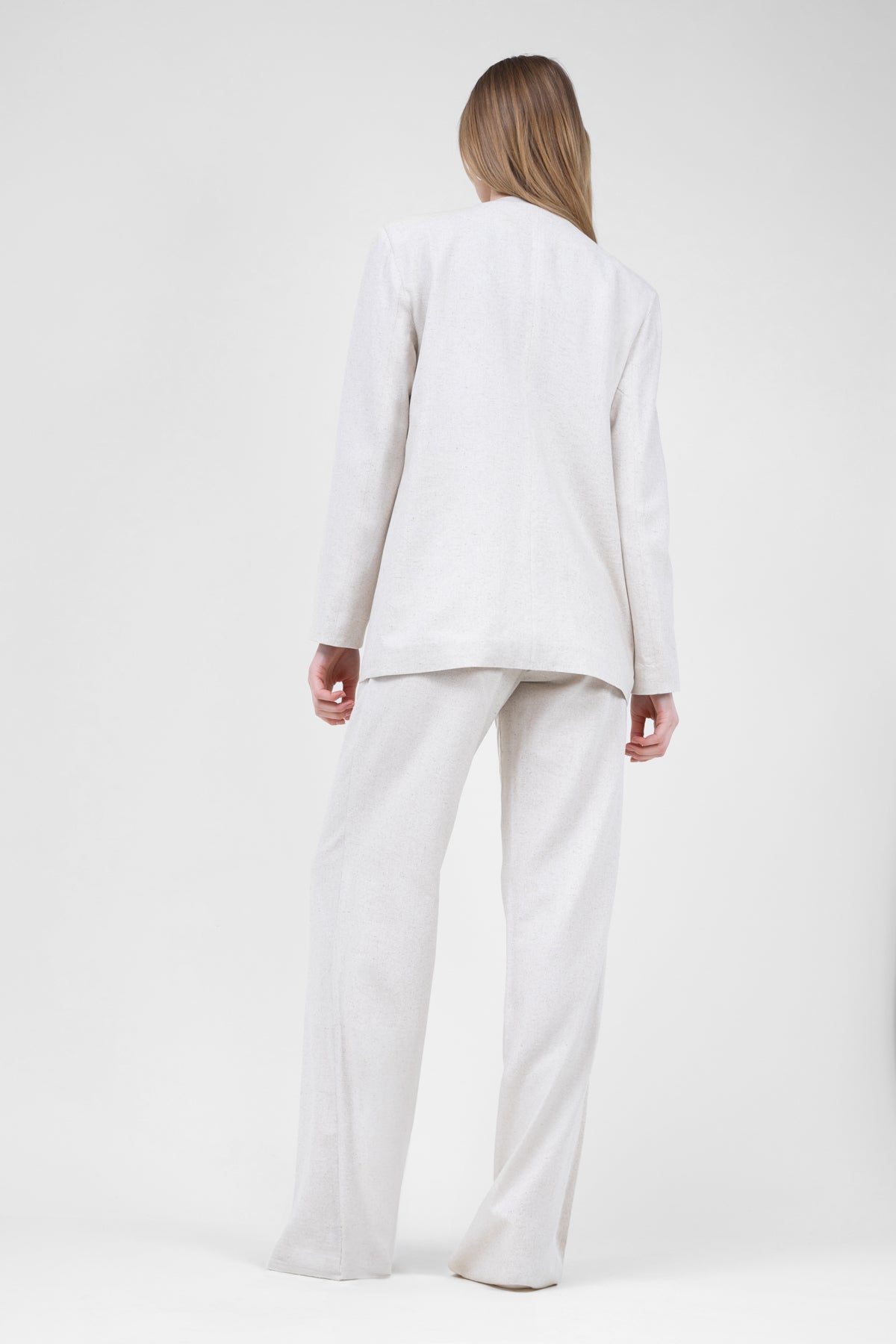 Ivory linen suit with blazer and straight trousers