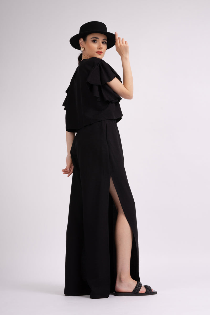 Black set with ruffled T-shirt and trousers with slits
