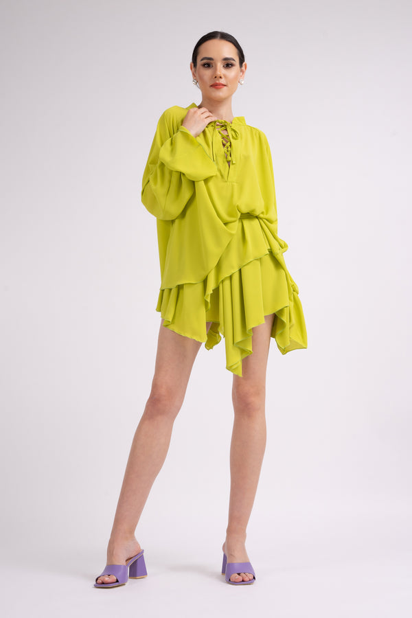 Neon green skirt with asymmetrical cut