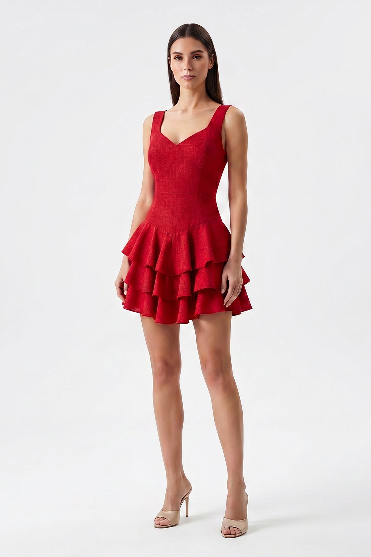 Red linen mini dress with fitted silhouette and layered ruffle skirt
