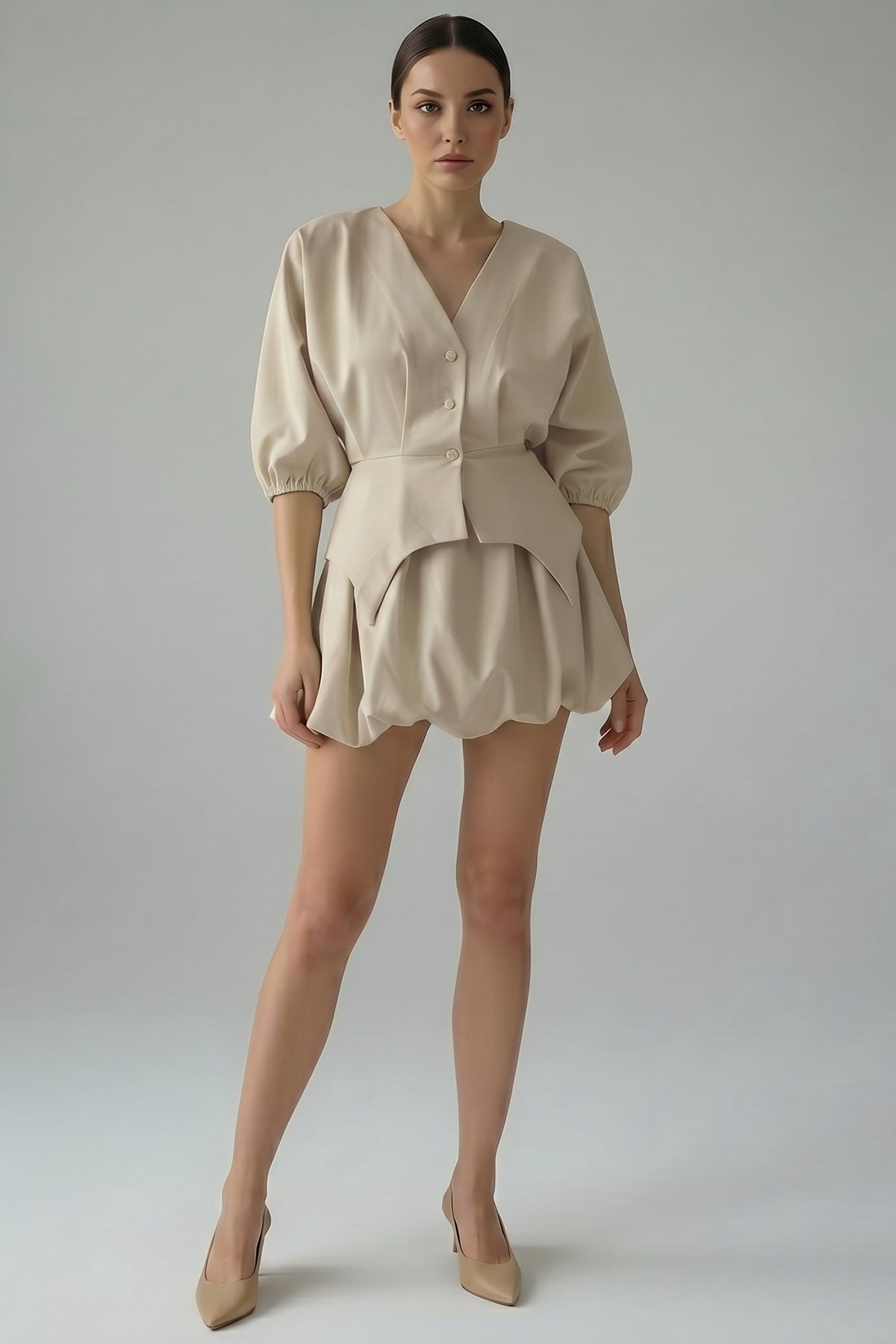 Beige set with structured top and balloon mini skirt