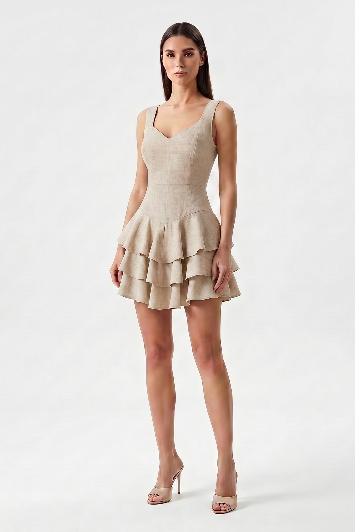 Beige linen mini dress with fitted silhouette and layered ruffle skirt