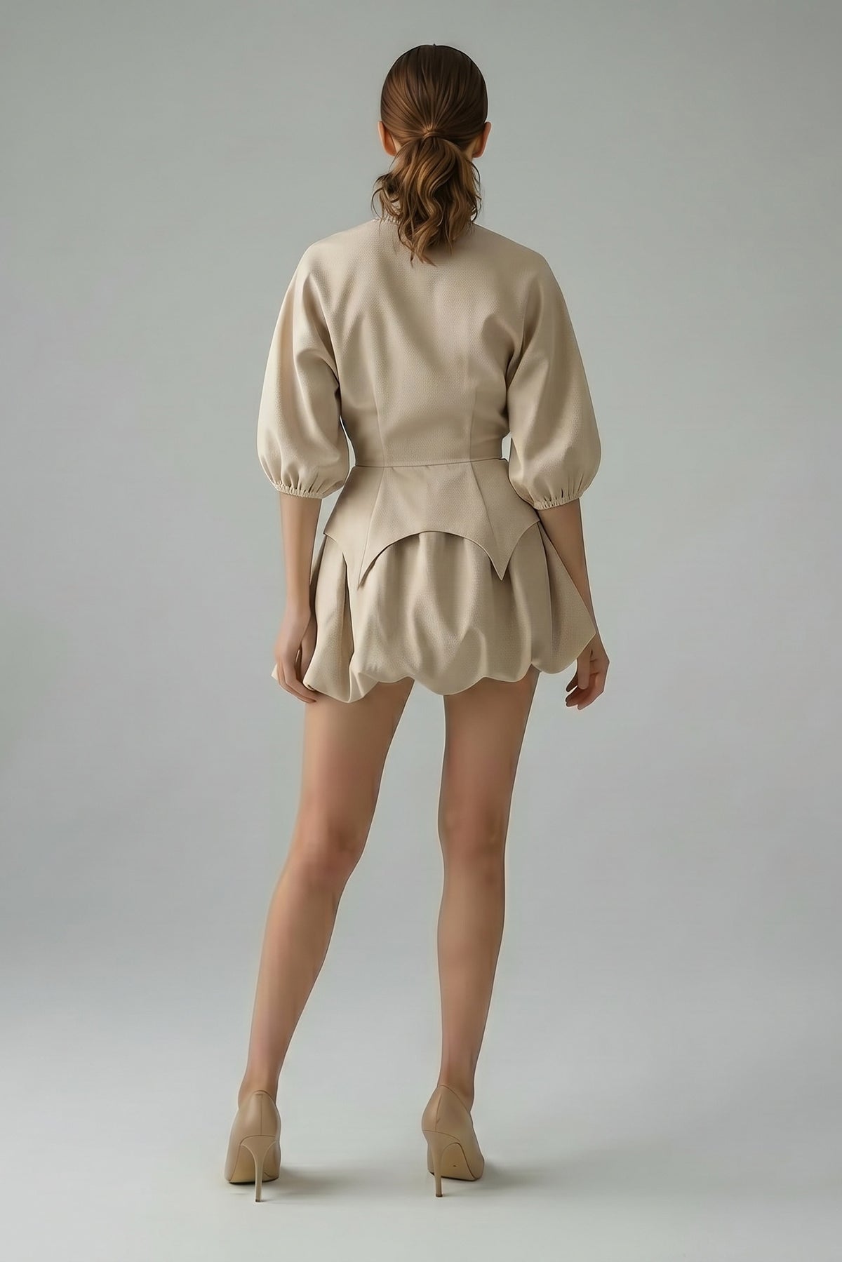 Beige set with structured top and balloon mini skirt