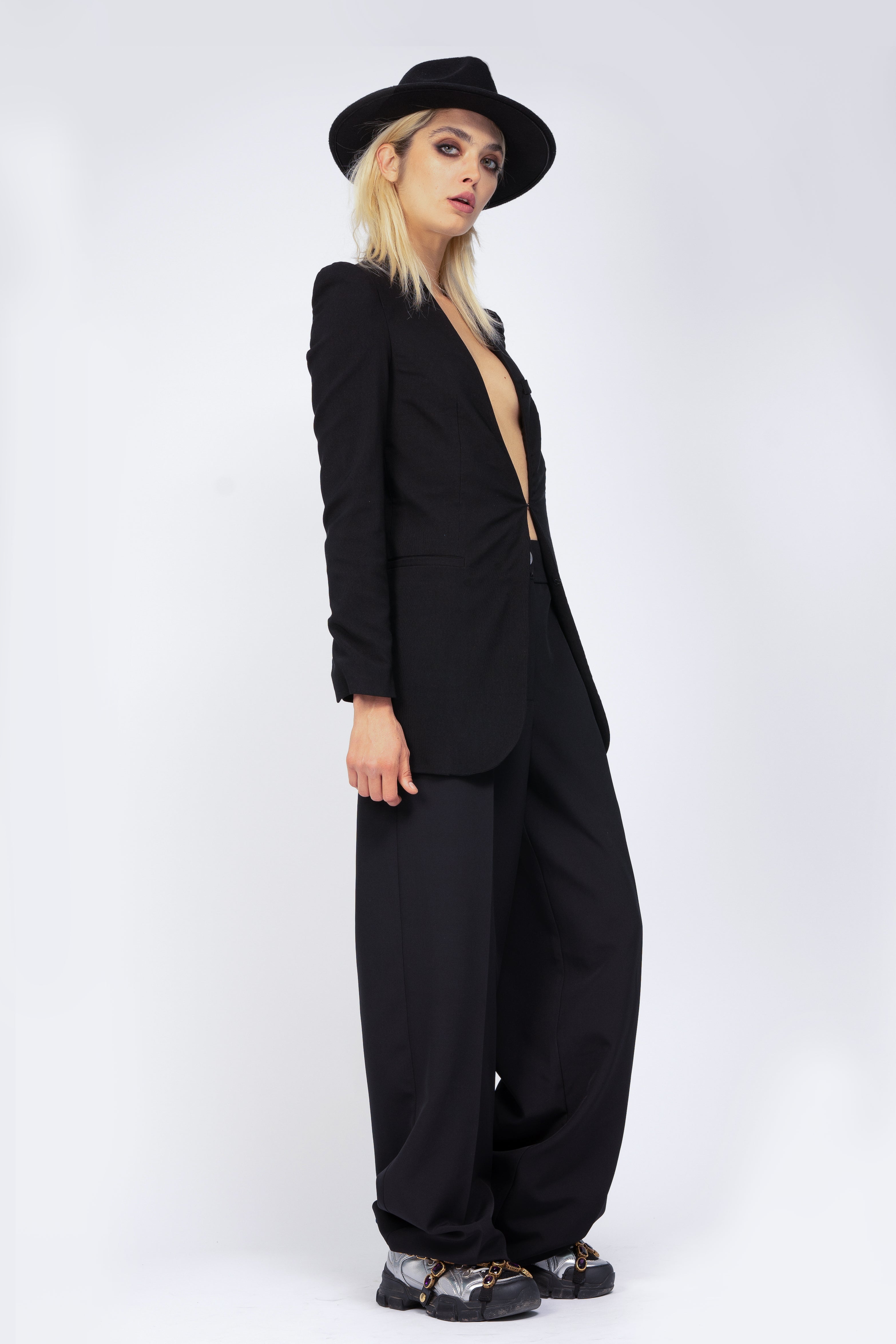 Black suit with sharped shoulders blazer