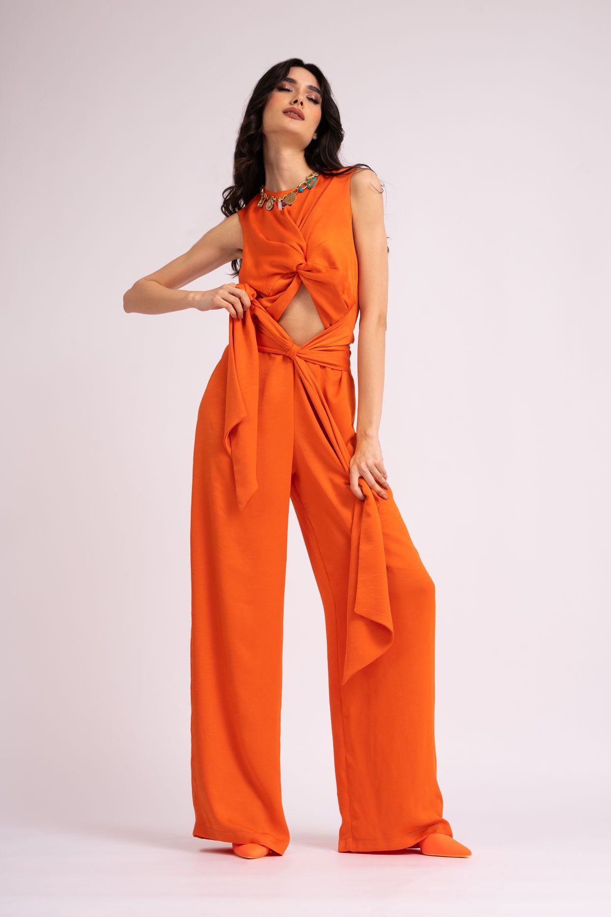Neon orange jumpsuit with knot