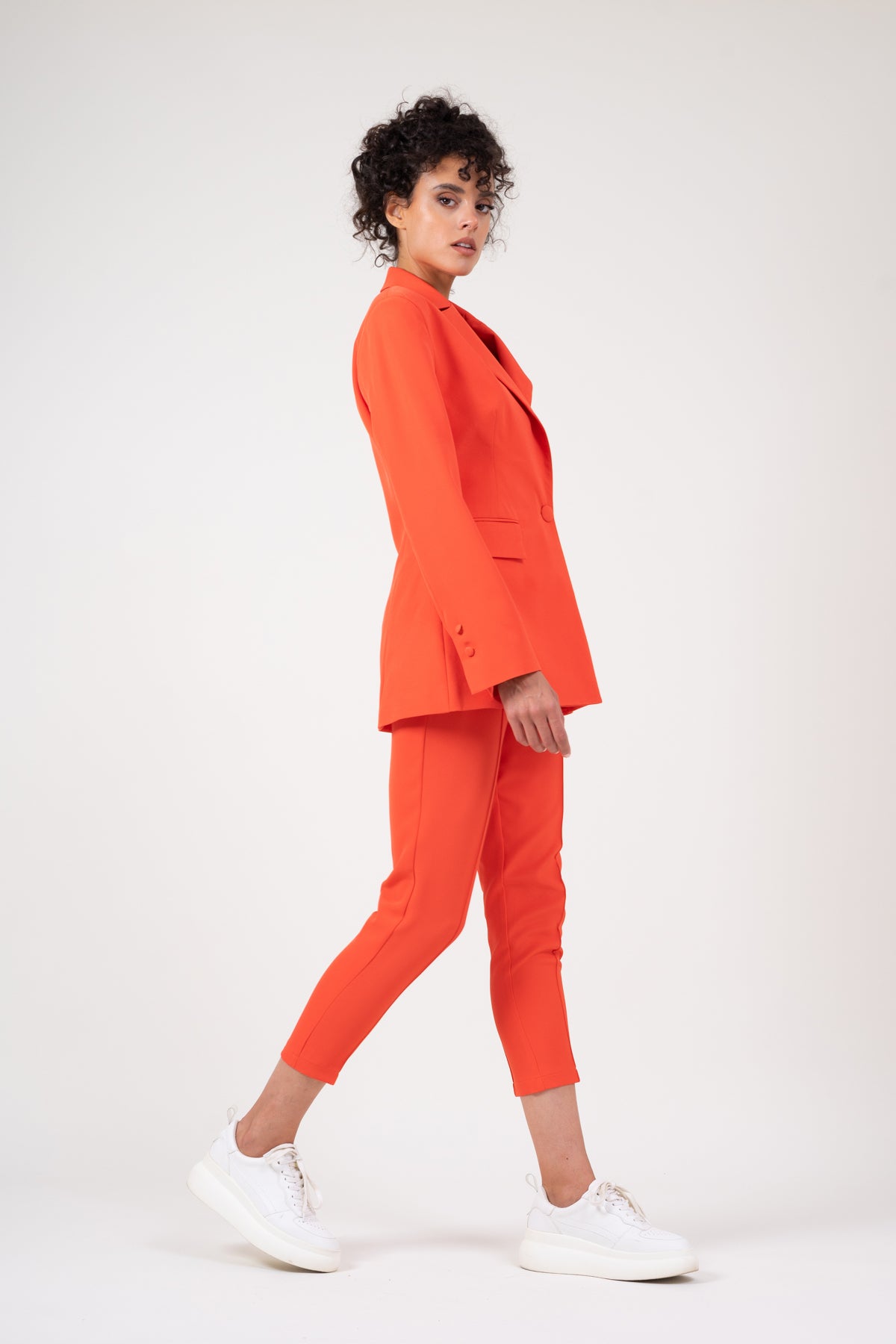 Orange slim fit trousers with piping effect