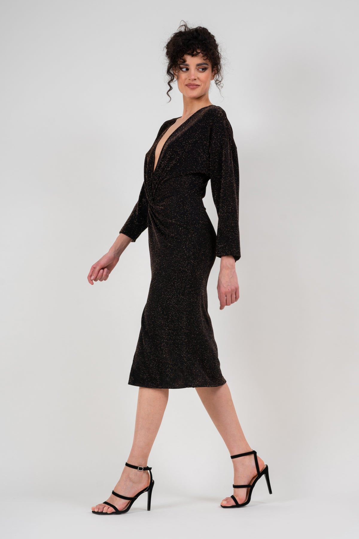 Black dress with gold inserts and knot