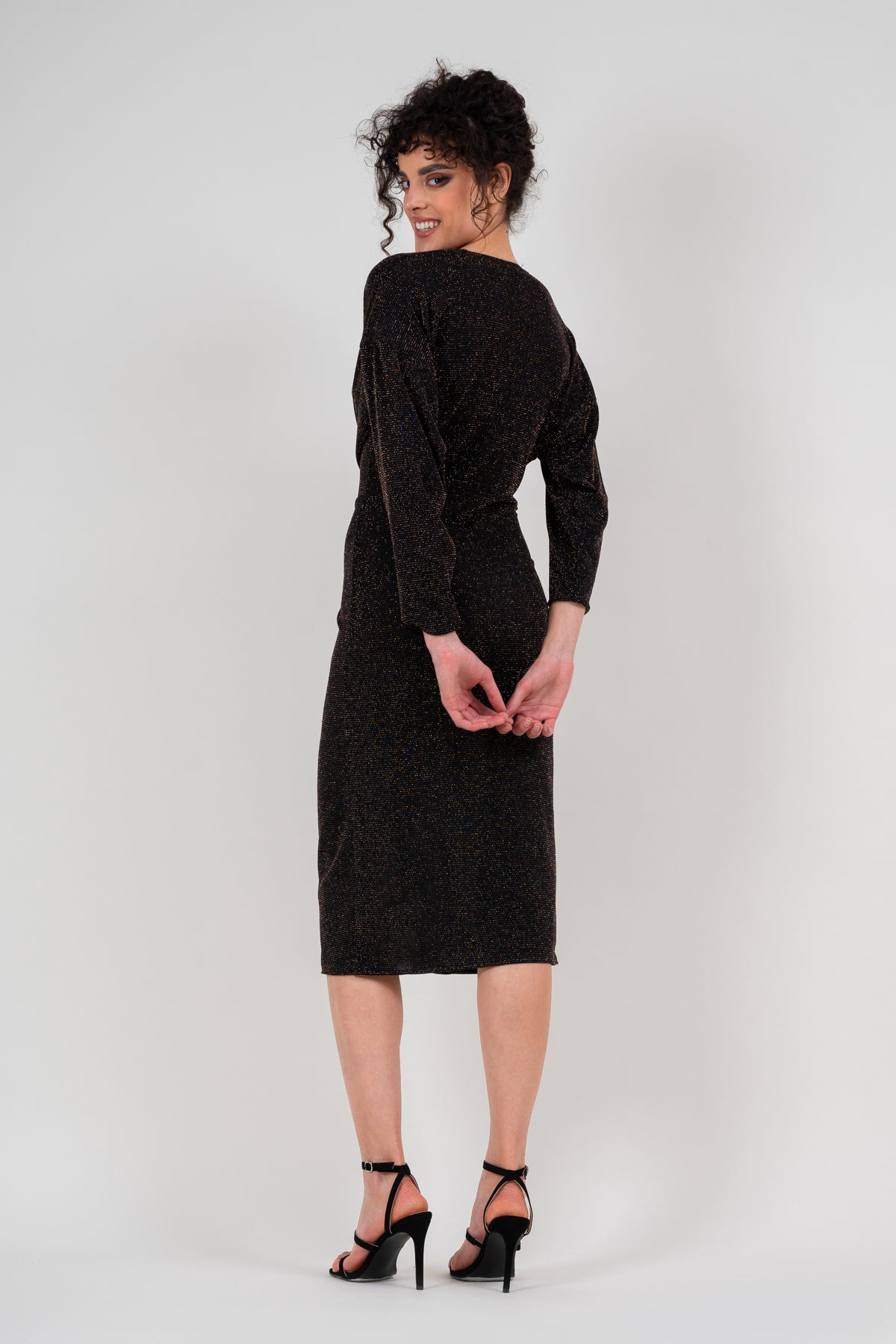 Black dress with gold inserts and knot