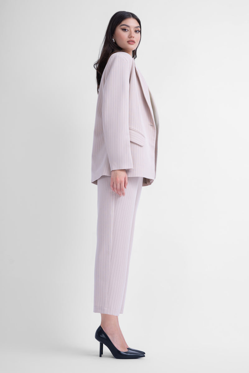 Beige pinstripe suit with regular blazer and cropped trousers