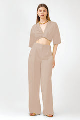 Beige matching set with cropped shirt and straight trousers