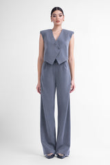 Grey pinstripe suit with asymmetrical vest and wide leg trousers
