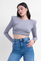 Grey crop top with proeminent shoulders and gathered detailing