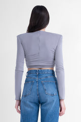 Grey crop top with proeminent shoulders and gathered detailing