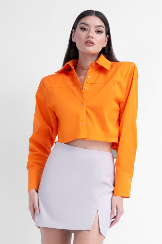 Bright orange cropped poplin shirt with oversized shoulders