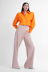 Beige asymmetrical wide leg trousers with button