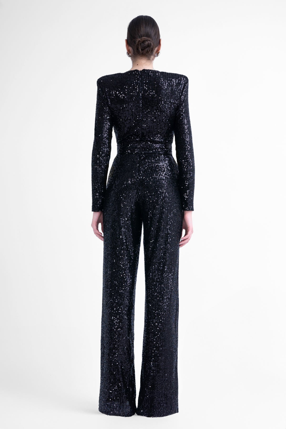 Black maxi jumpsuit with structured shoulders and belt