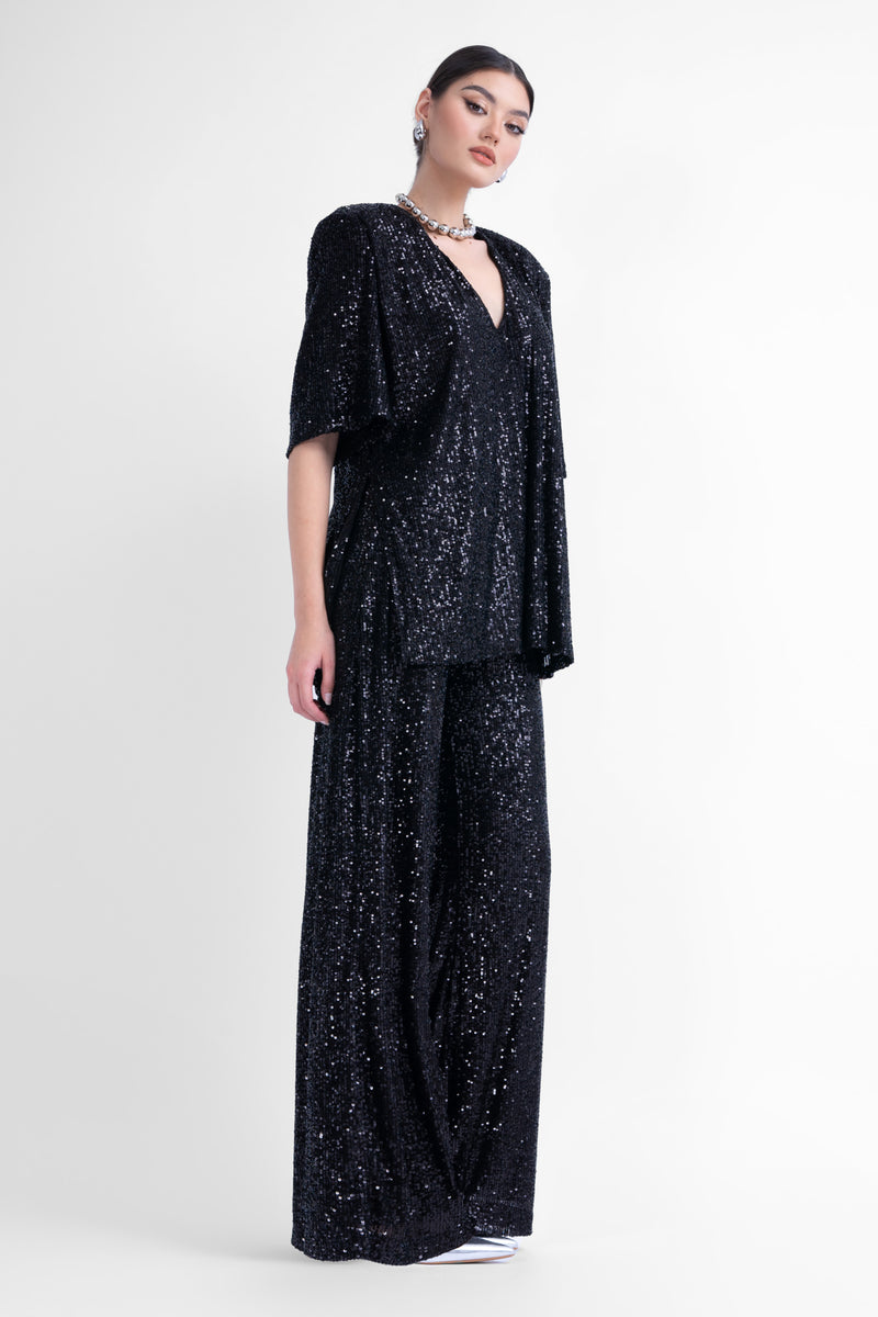 Oversized black sequined blouse with side slit