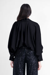 Black blouse with draped sleeves and v-neck