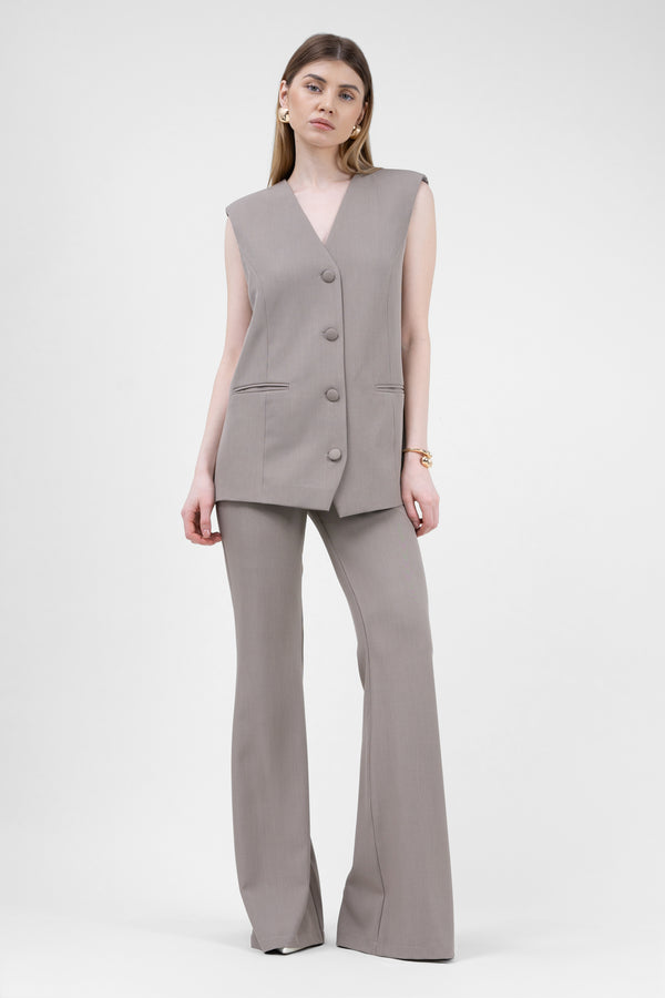 Beige suit with oversized vest and flared trousers