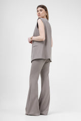 Beige suit with oversized vest and flared trousers