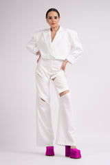 White suit with oversized cropped blazer and trousers with zippers