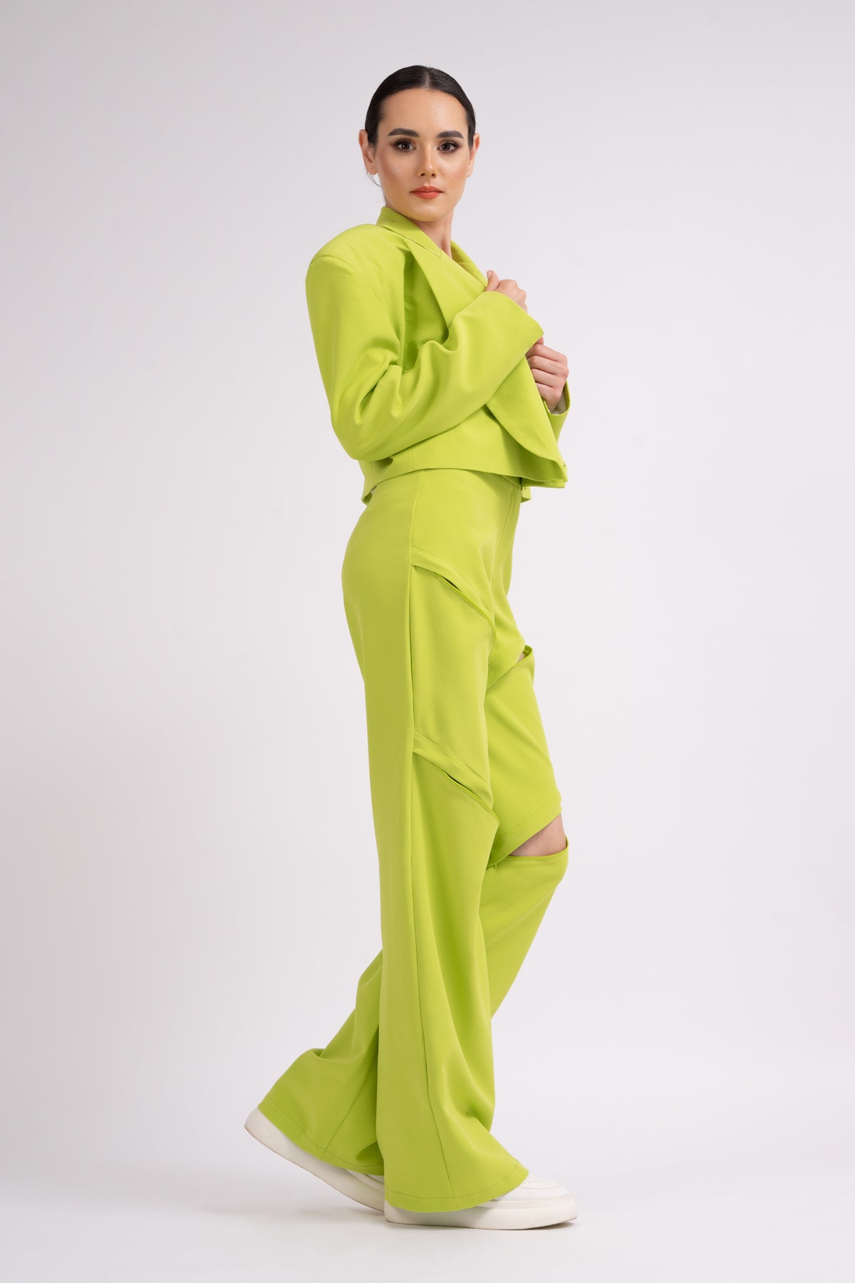 Lime suit with oversized cropped blazer and trousers with zippers