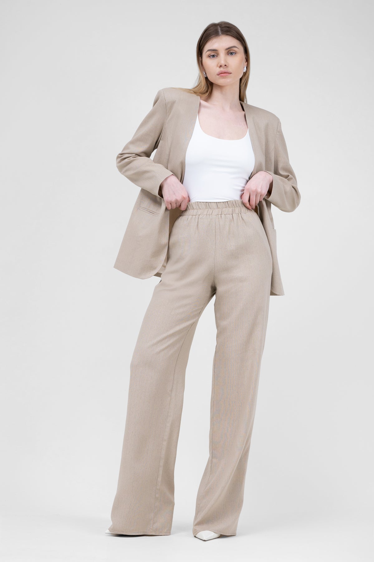 Beige linen suit with blazer and straight trousers