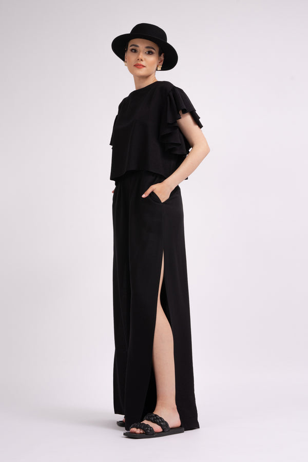 Black set with ruffled T-shirt and trousers with slits