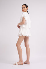 White set with ruffled T-shirt and pants with skirt