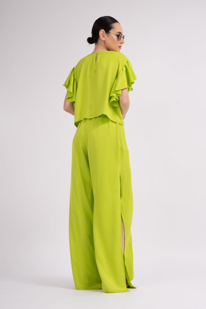 Neon green set with ruffled T-shirt and trousers with slits