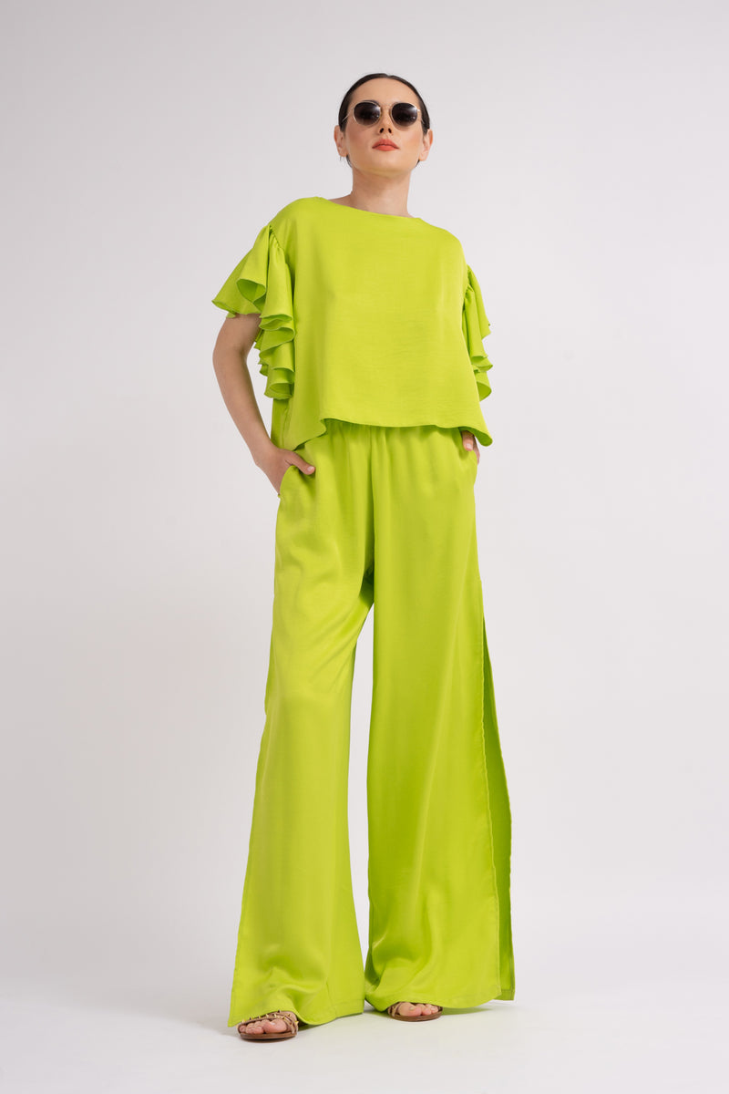 Neon green set with ruffled T-shirt and trousers with slits