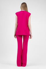 Fuchsia suit with oversized vest and flared trousers