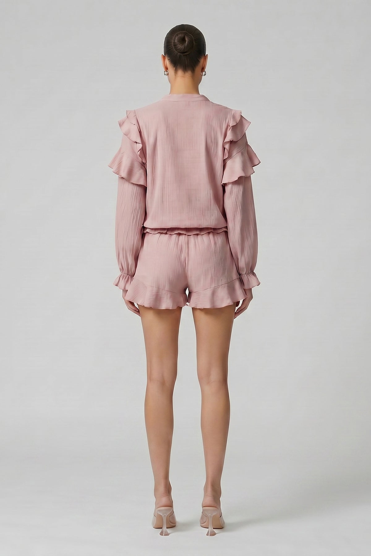 Pink linen-viscose blend set with ruffle top and shorts