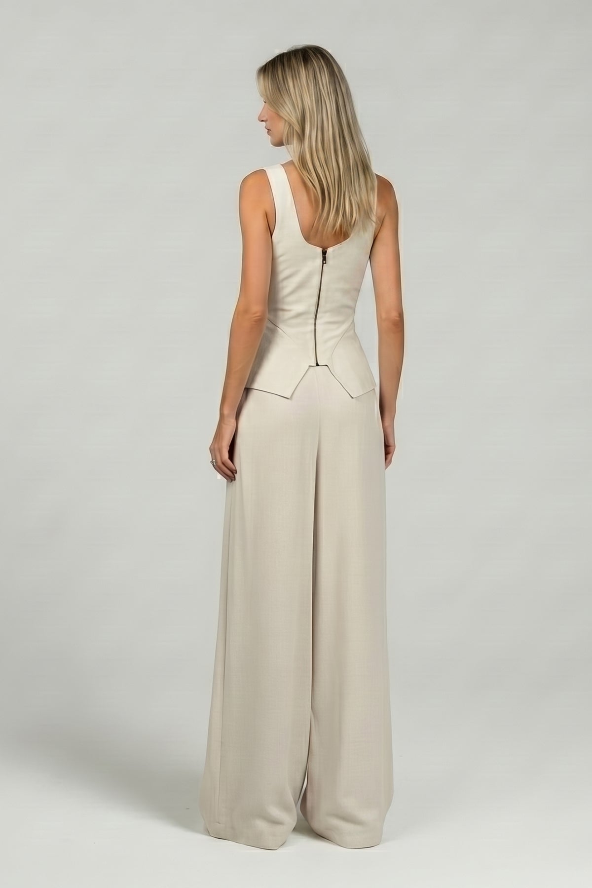 Ivory set with peplum-style corset and wide-leg trousers