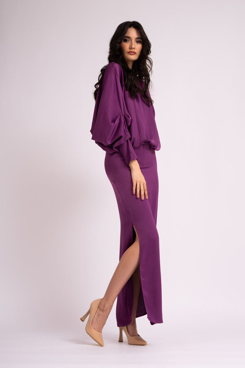 Deep purple dress with draped neckline and flared sleeve