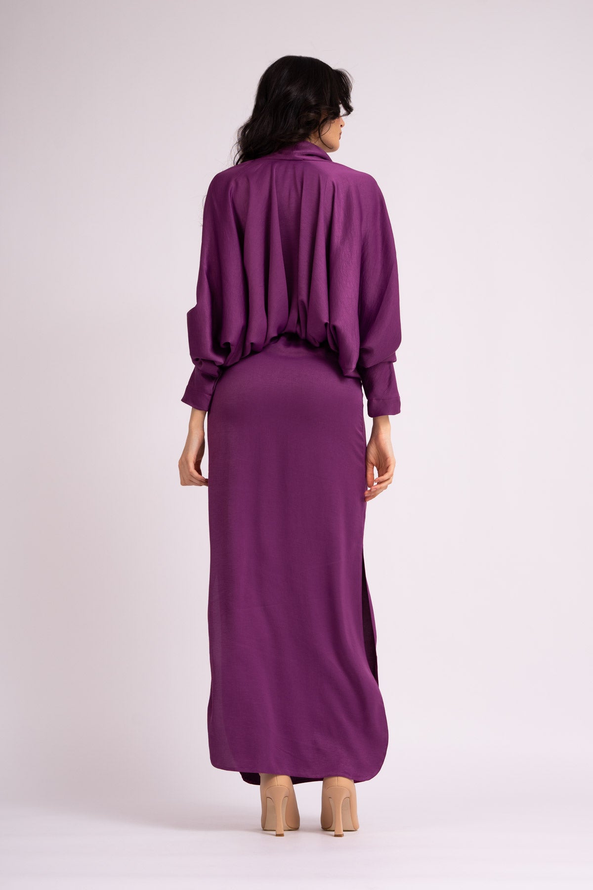Deep purple dress with draped neckline and flared sleeve