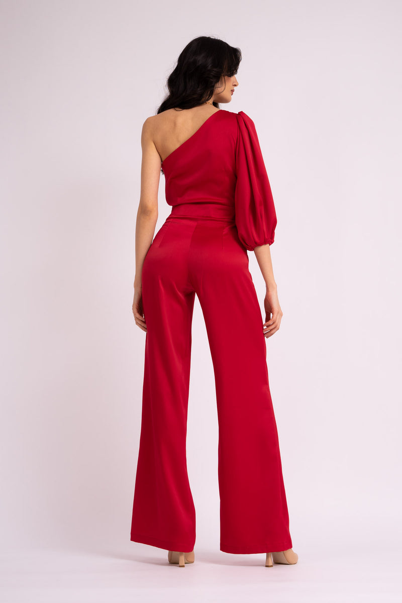 Red maxi jumpsuit with one flared sleeve