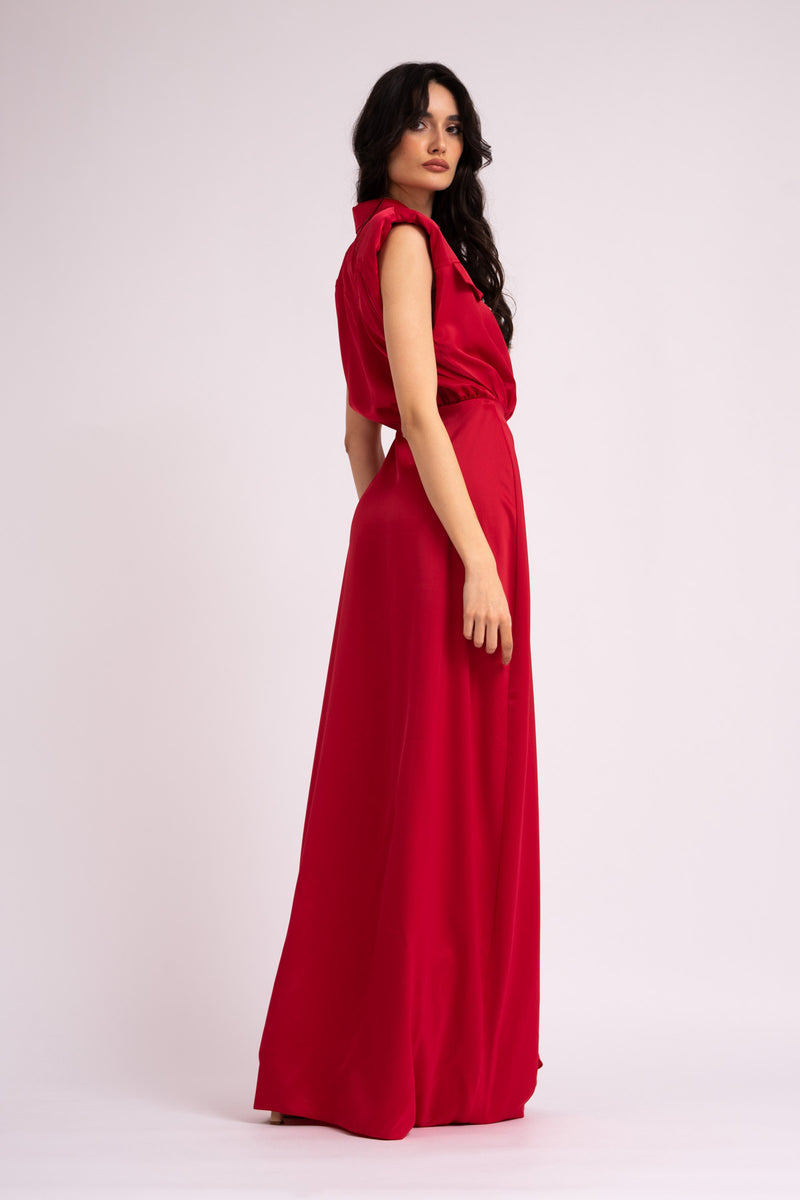 Red maxi dress with oversized shoulders and ruffled slit