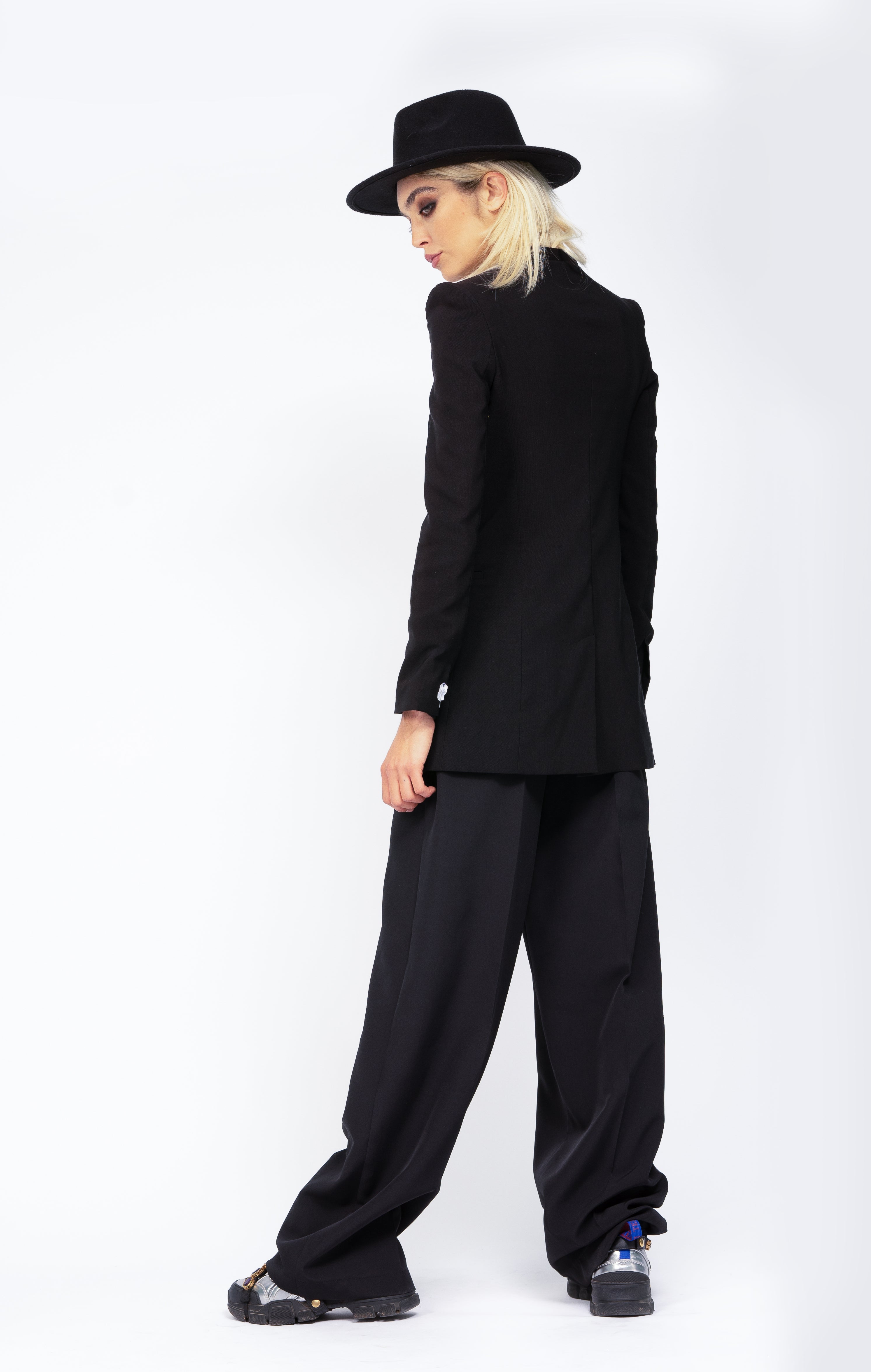 Black suit with sharped shoulders blazer