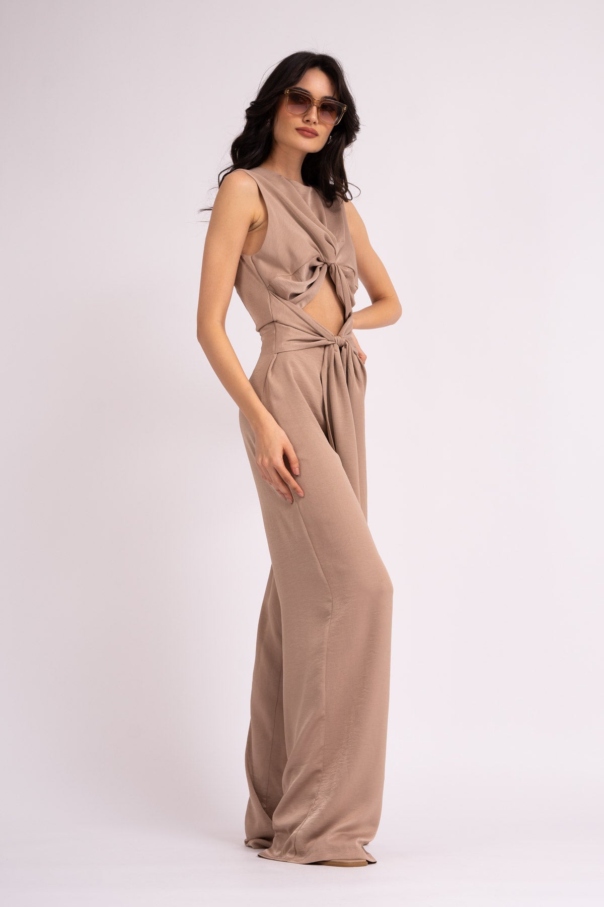 Beige jumpsuit with knot