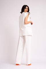 White suit with oversized vest and wide leg trousers