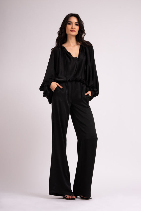 Black wide leg trousers with elastic waistband.