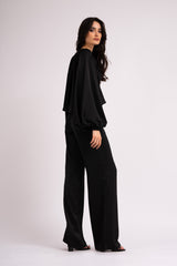 Black wide leg trousers with elastic waistband.