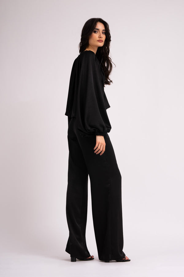 Black wide leg trousers with elastic waistband.