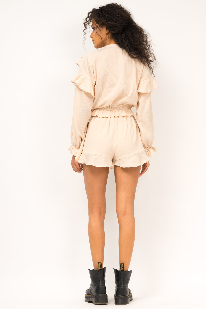 Airy beige blouse with ruffles