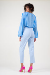 Blue draped top with padded shoulders