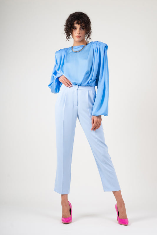 Blue draped top with padded shoulders