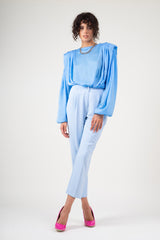 Blue draped top with padded shoulders